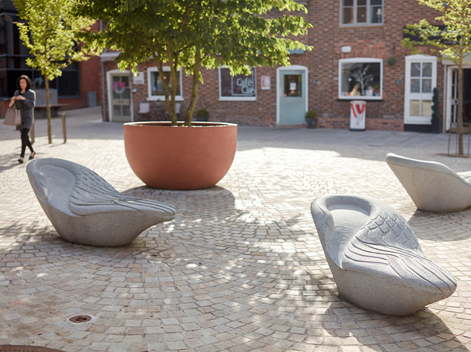 Symbolic geese-like seats on a city street