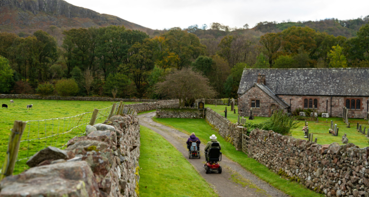 Wheelchair users on path