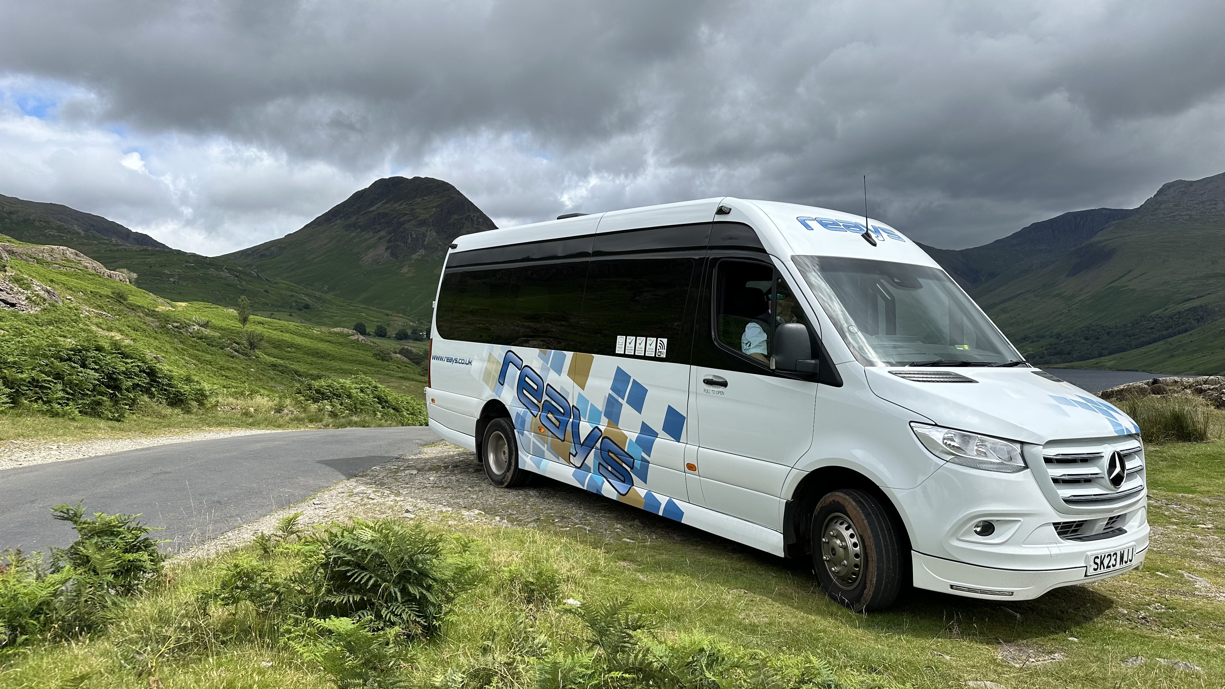 Wasdale shuttlebus parked up with mountains in background