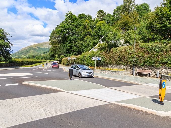 Stone laid pedestrain crossing on a rural road.