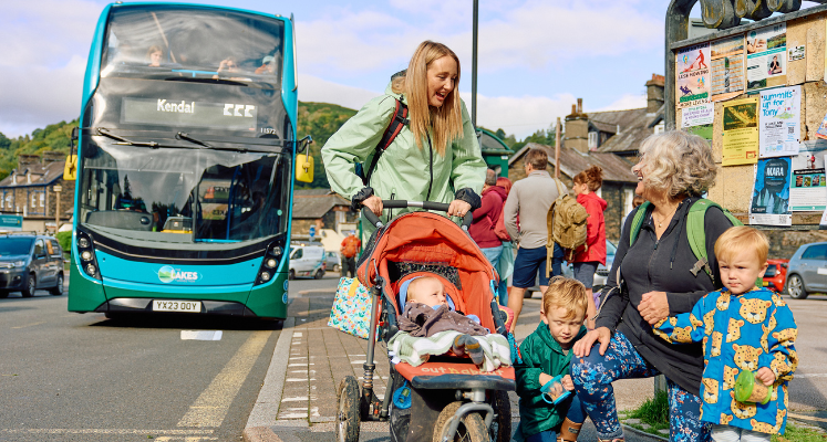 Family looking at view next to the bus