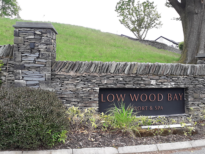 Stone wall with sign for Low Wood Bay Resort and Spa