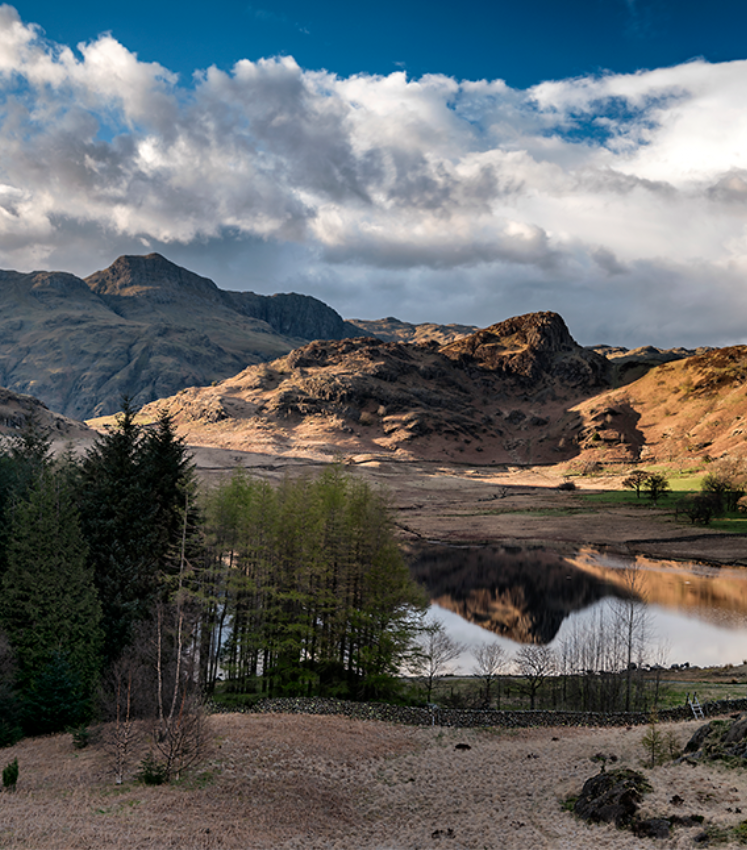 Langdale mountains reflecting into blea tarn%