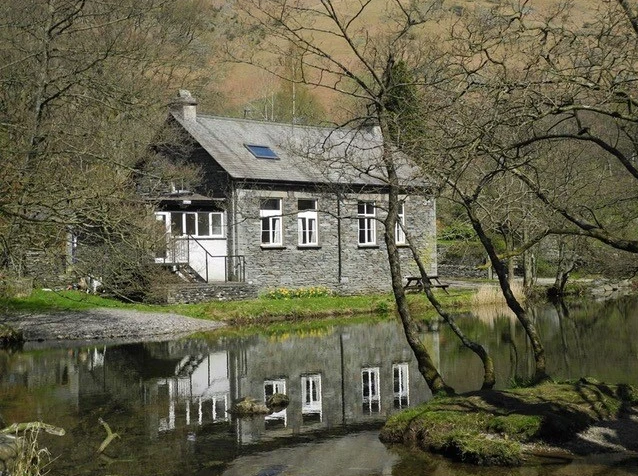 weirdside bunkhouse photo of building by river