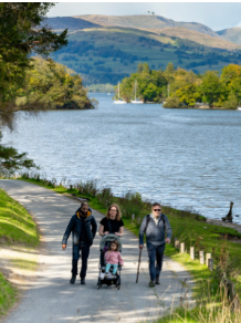 Family with a buggy on a walk