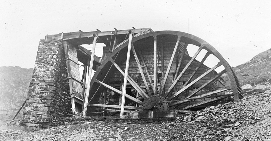 historic imagery of the old engine house waterwheel at Coniston Coppermine, sourced by the Ruskin Museum.