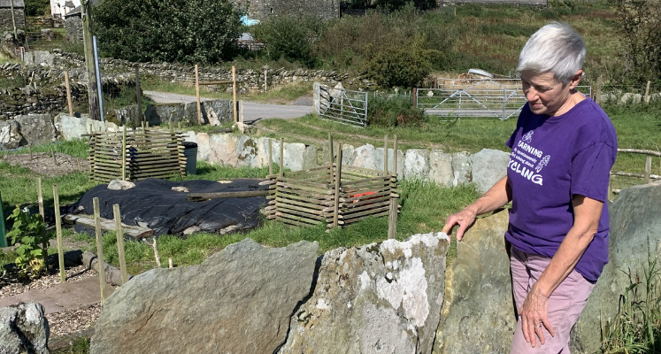 Lady stood with completed wall