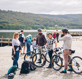 Family at Coniston on bikes.