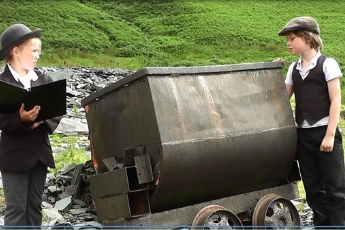 two children in period dress at Coniston Copper site