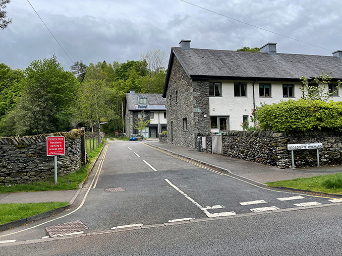 Road junction with dry stone walls.