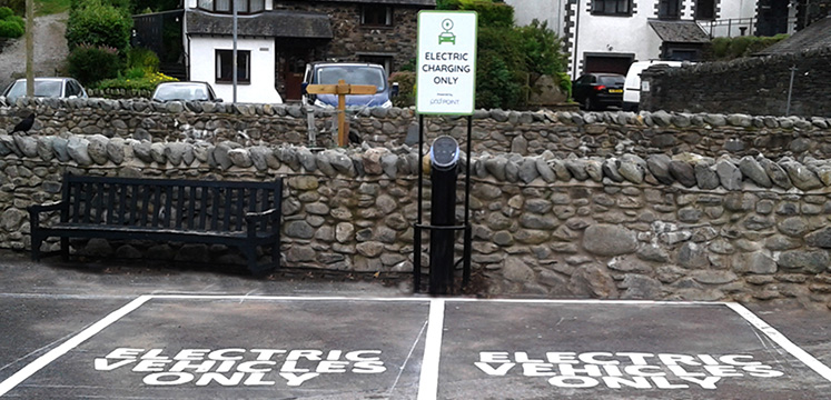 An electric car charging point in Glenridding car park