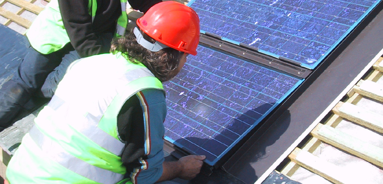 Workmen installing solar panels copyright Sundog Ltd