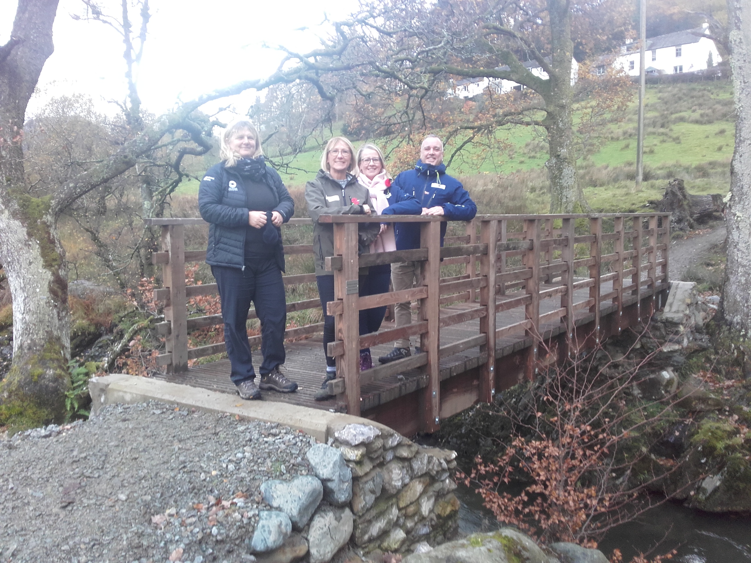 Lake District National Park Area Ranger witH HF Holidays on the rebuilt Ghyll Brow bridge