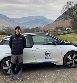 LDNPA staff stood next to our electric vehicle.