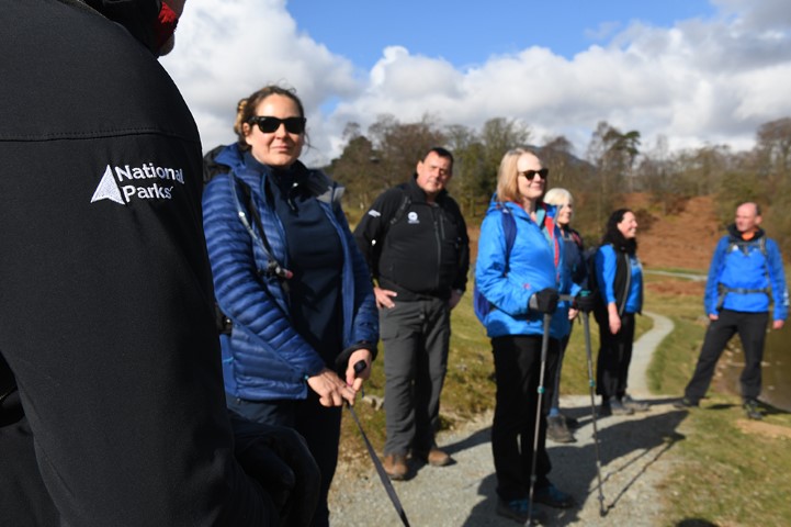 Walk leader talking to a group on a guided walk.