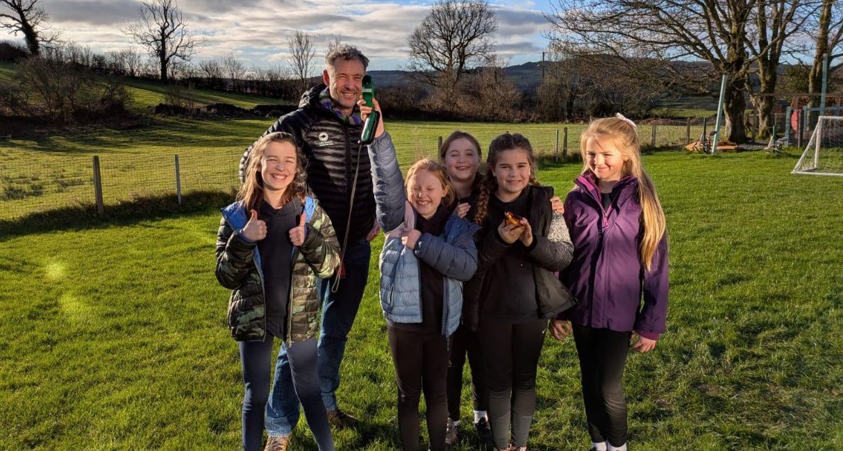 Jim Evans and children at Crosthwaite Primary School