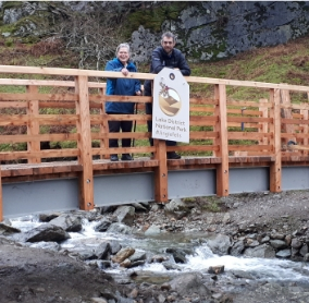 Vivienne Rees, Chair of Grasmere Village Society with David Switzer, LDNP area ranger for the Central and South East at Greehead Gill Bridge, Grasmere.