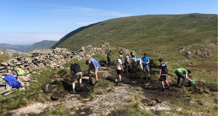 Group of Young Rangers working together on the fells for path maintenance