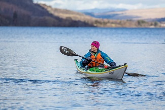 Woman kayaking on Lake Windermere.