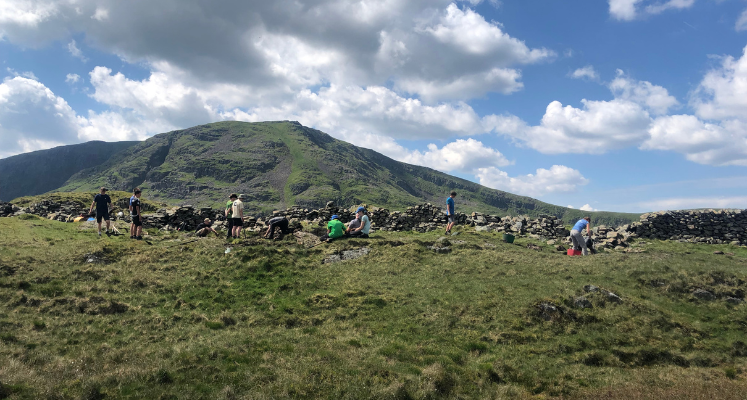 Wide shot of Young Rangers on the fell working on path maintenance