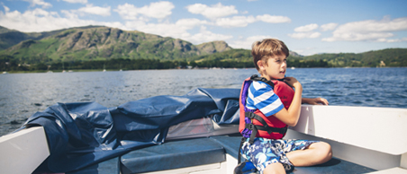 Child on a motor boat on Coniston Water