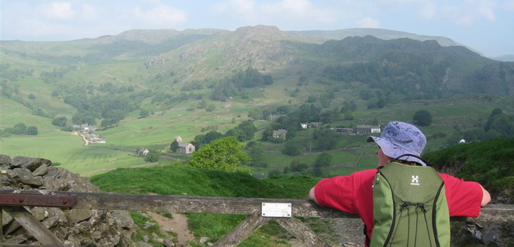 Walker taking in the Kentmere valley view copyright Helen Reynolds