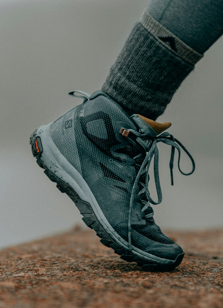 Teel walking boot stepping on orange stone