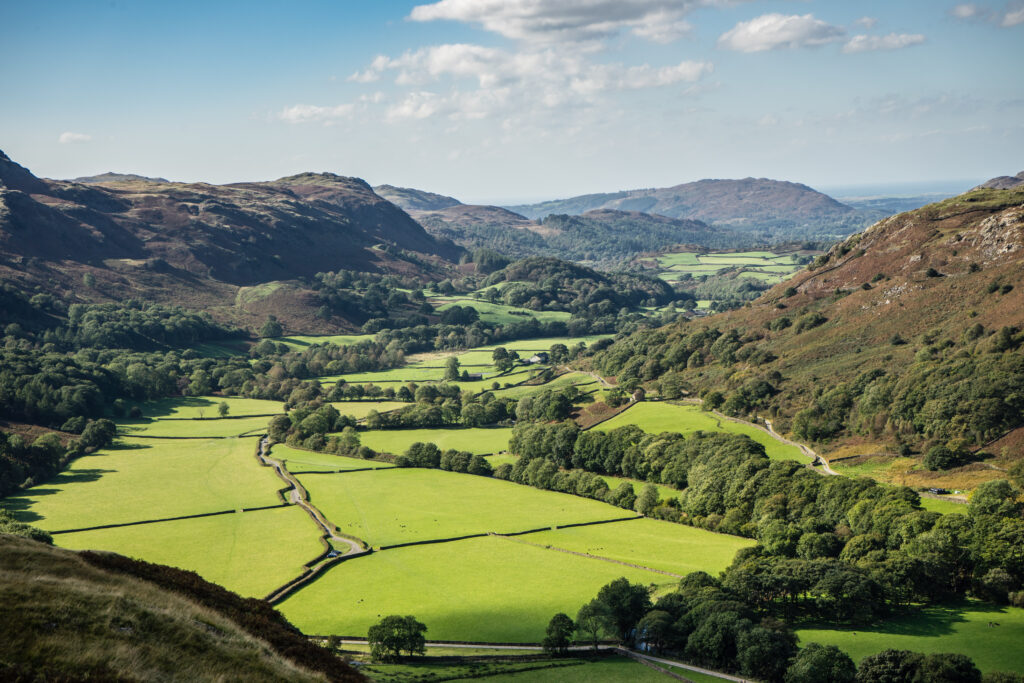 Eskdale valley in summer with green fertile land in the foreground used for farming