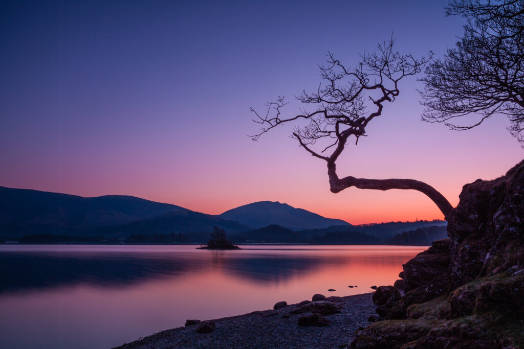 A purple and orange sunrise over Derwent Water