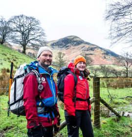 Two people at an archaeological dig in the fells. 