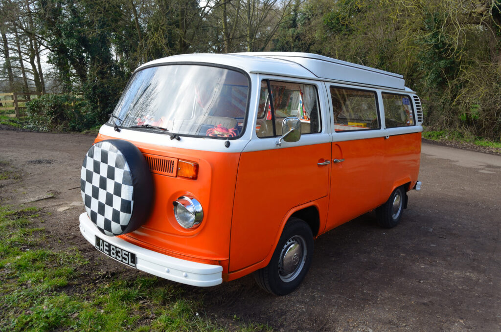 Classic Volkswagen Camper Van in White and Orange