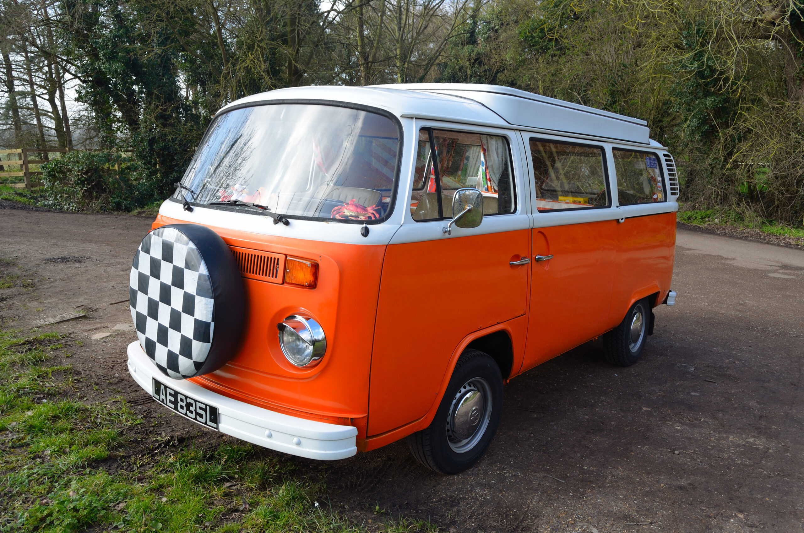 Classic Volkswagen Camper Van in White and Orange