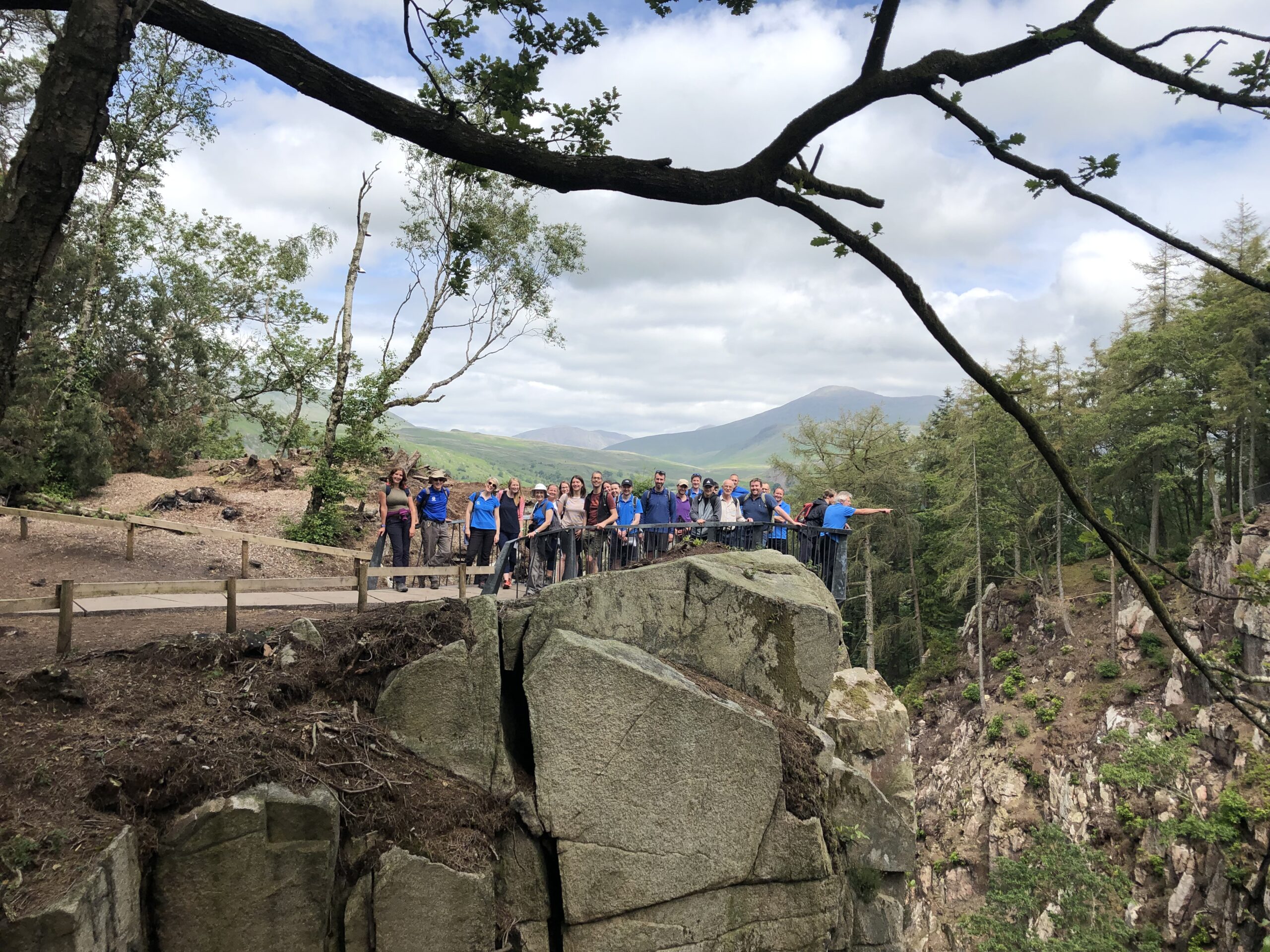 A group of people stood on stanley ghyll viewing platform