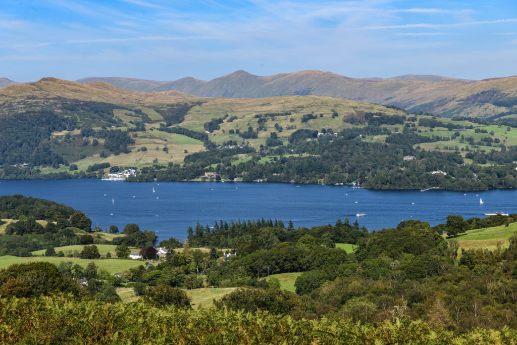 landscape view of windermere lake and houses on a sunny day