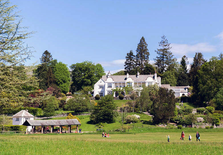 Brockhole on Windermere with families walking across the lawns
