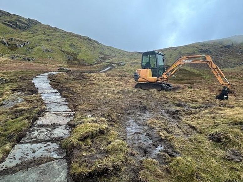 digger beside repaired flagstones