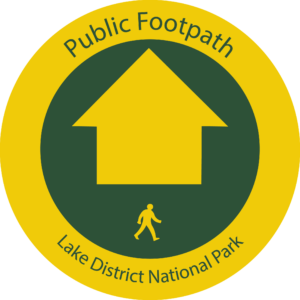 Yellow roundel with green circle and yellow arrow. Person icon and text reading ublic Footpath