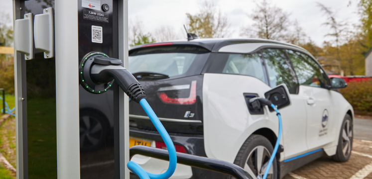 electric car at electric charging station within the Lake District National Park