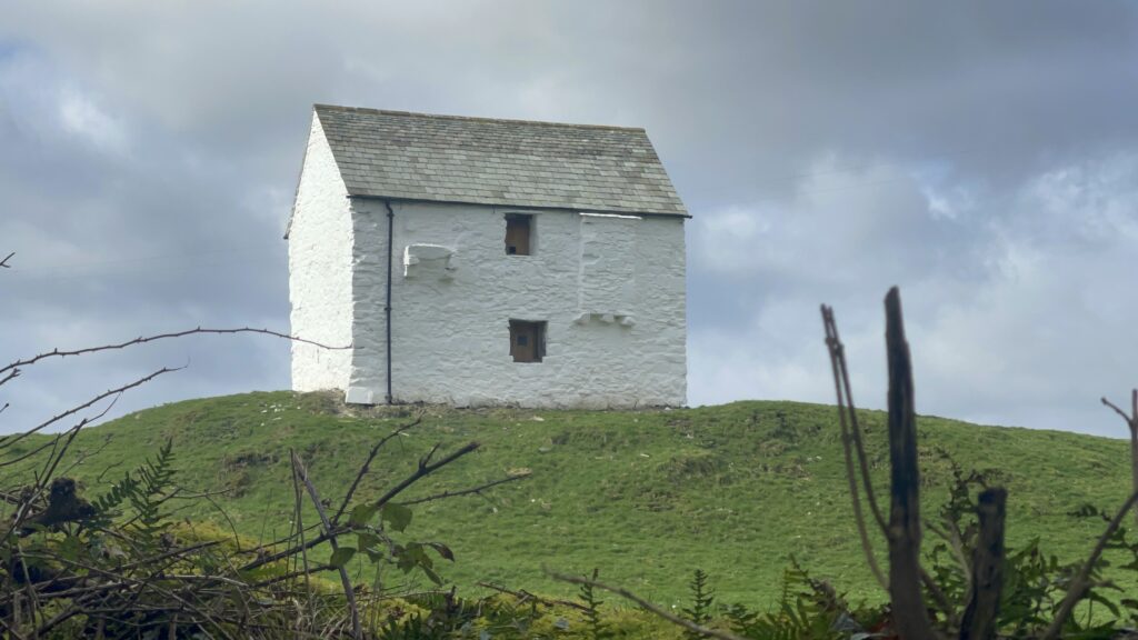 henry's castle, a small white lime wash farm building stood alone in a field