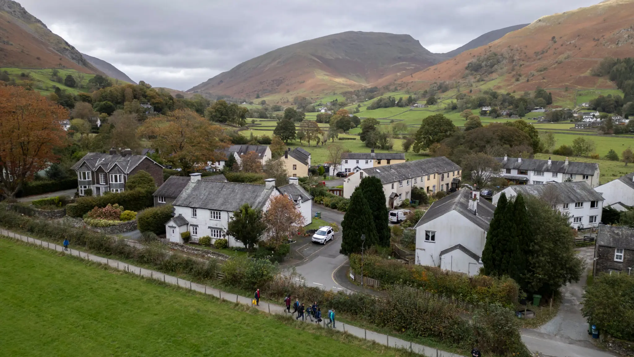 aerial view of a white house village in the rural fells