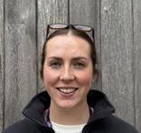 headshot of woman smiling to camera in lake district national park authority uniform